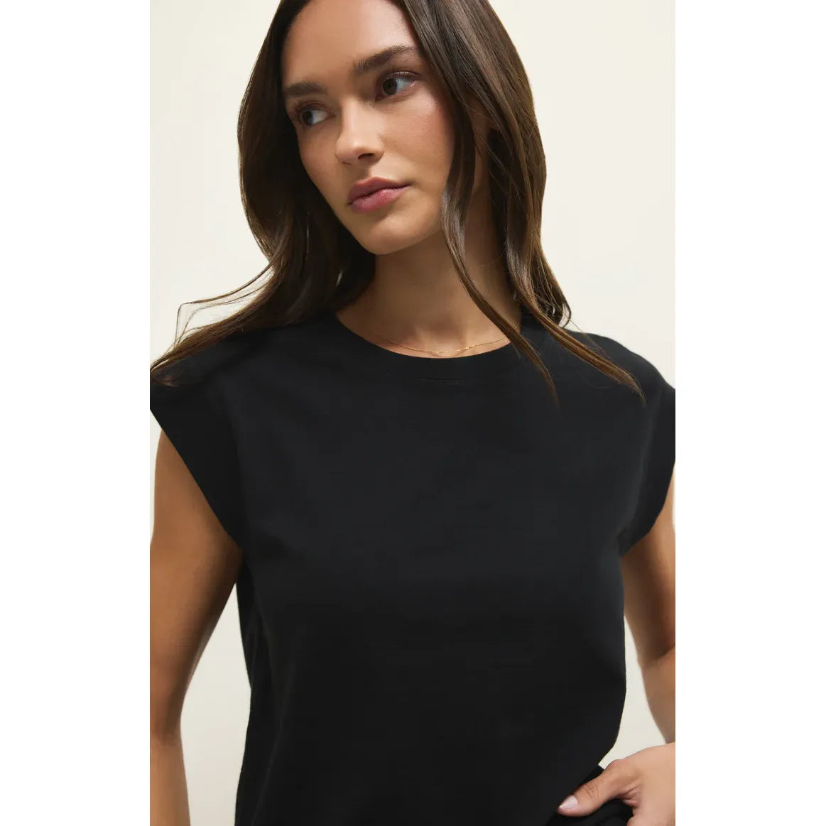 Model wearing a black Camino Jersey Top with relaxed crewneck and statement sleeves.