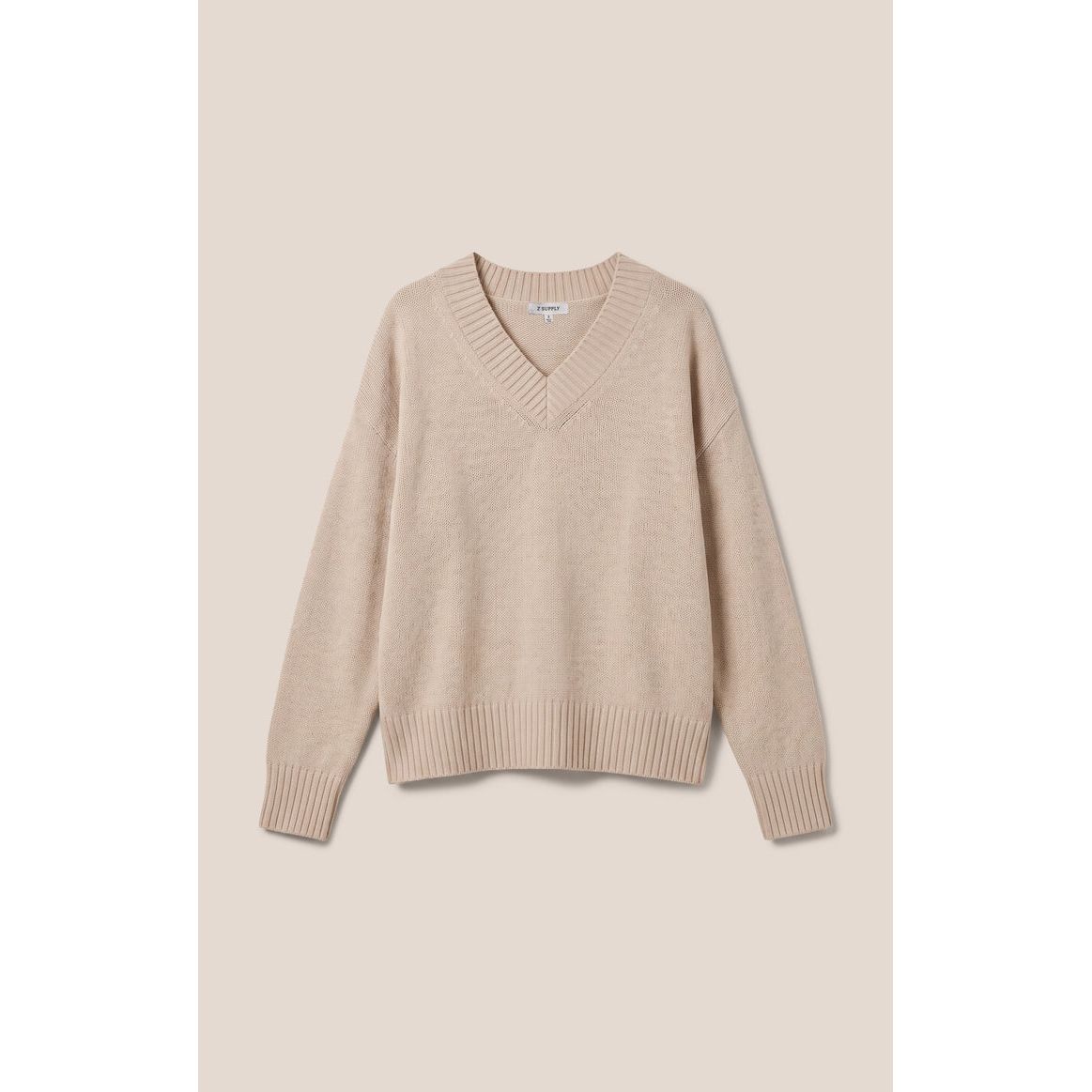 Z Supply Cloud Spun V-Neck Sweater in Frosted Pearl. Soft, relaxed knit with ribbed collar, cuffs, and hem for easy layering.