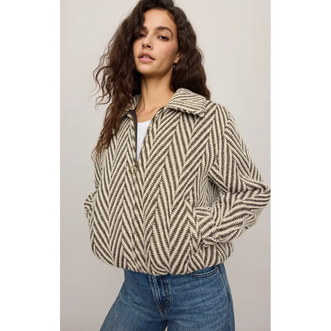 Vintage-inspired bubble jacket with rich herringbone texture, antique brass zip closure, and modern effortless silhouette.