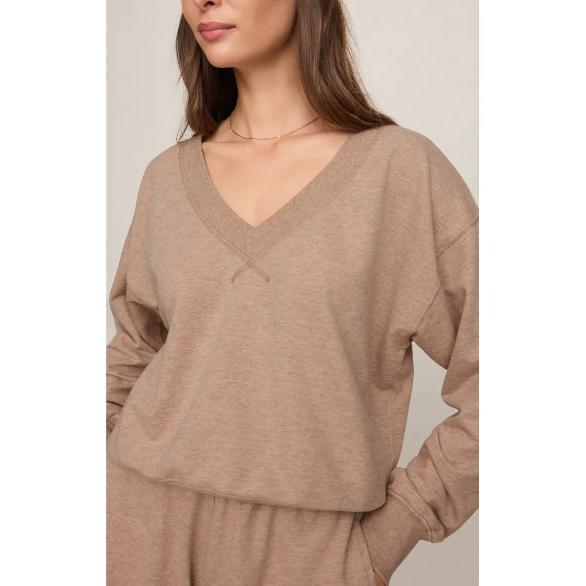 Z Supply Everyday V-Neck taupe sweater on model with open neckline and relaxed fit.
