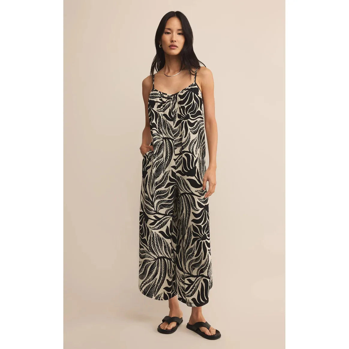 Z Supply Flared Palm Jumpsuit black cream tropical palm print on model, airy gauze, wide-leg summer silhouette