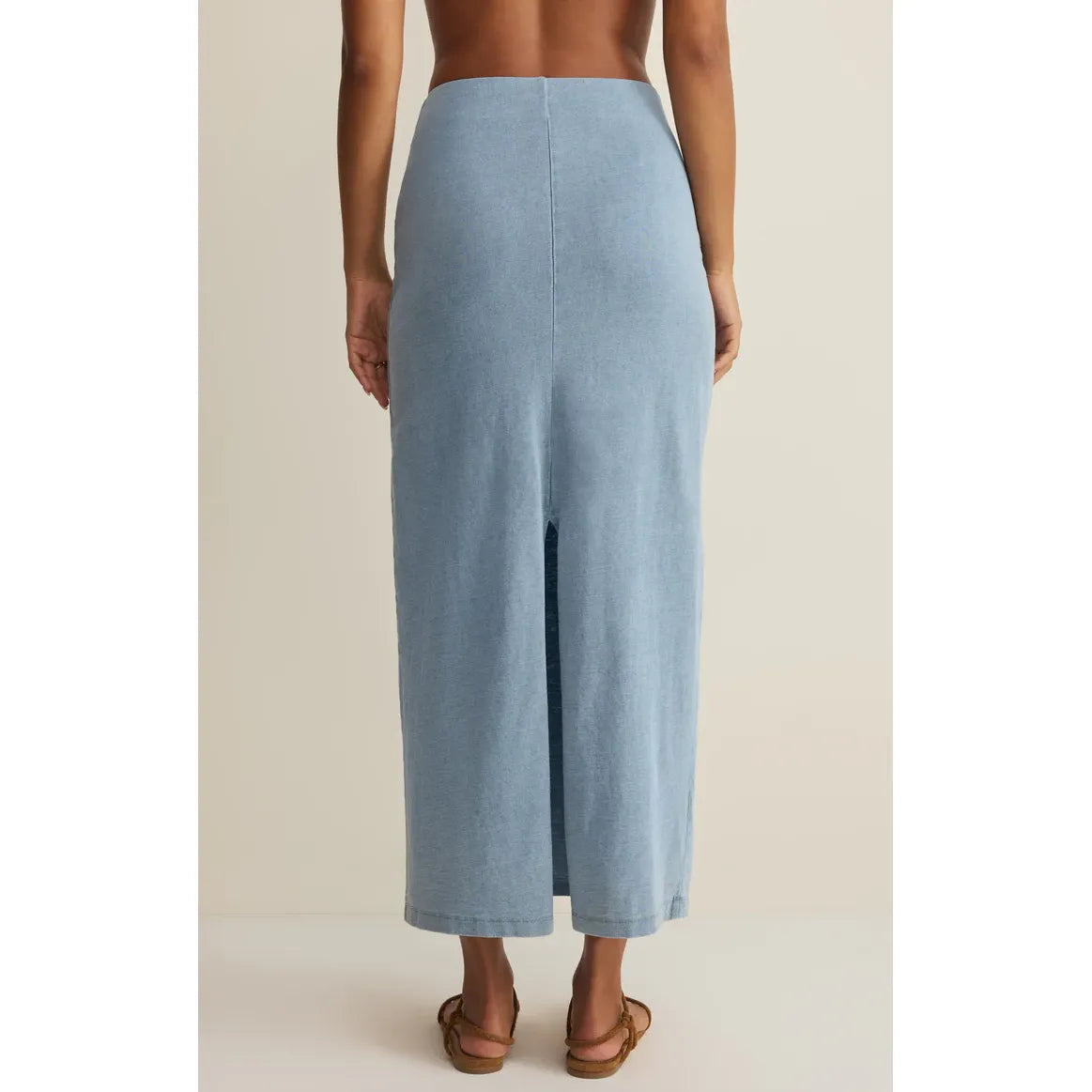 Back view of Z Supply Gail Midi Skirt in light blue cotton jersey with elastic waist and center back slit.