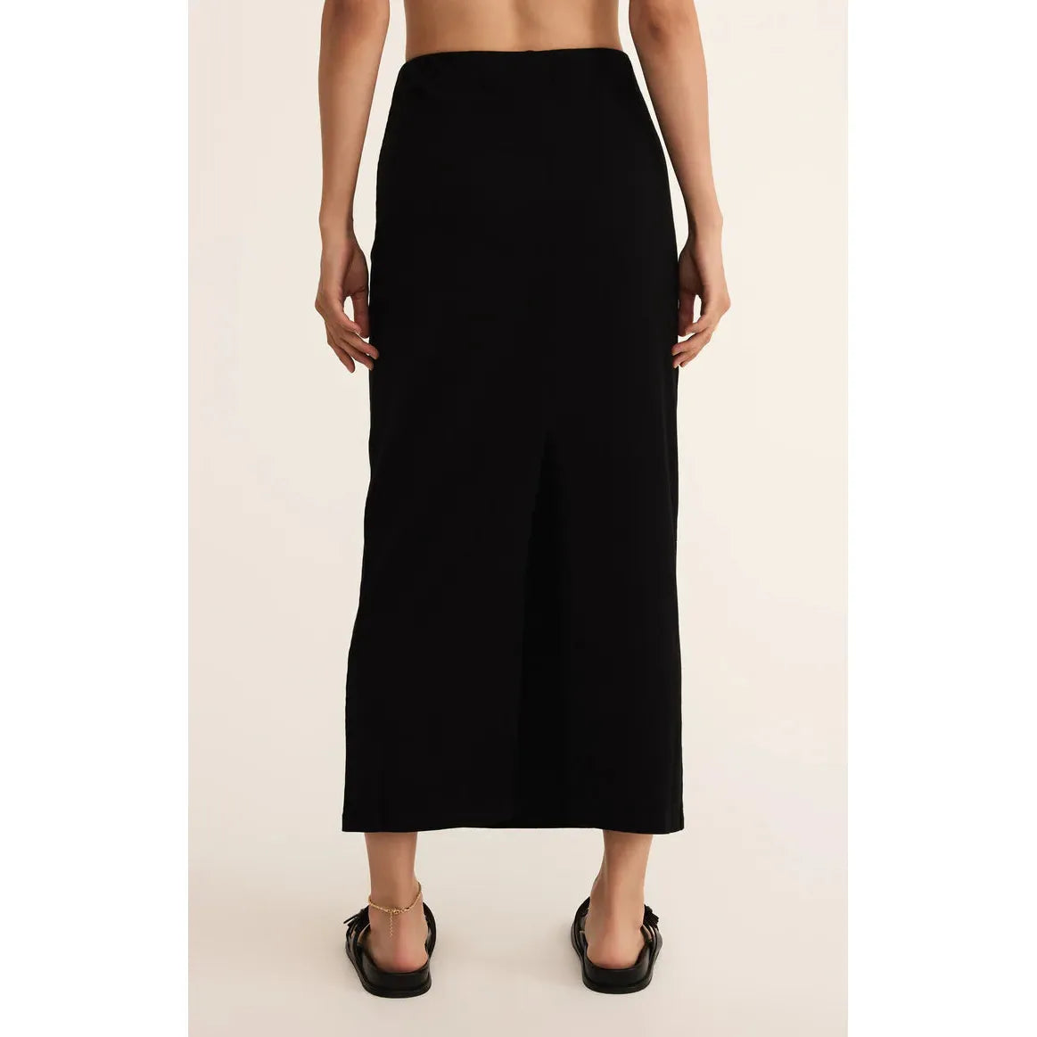 Z Supply Gail Jersey Denim Midi Skirt in true black — back view with elastic waist and straight midi silhouette