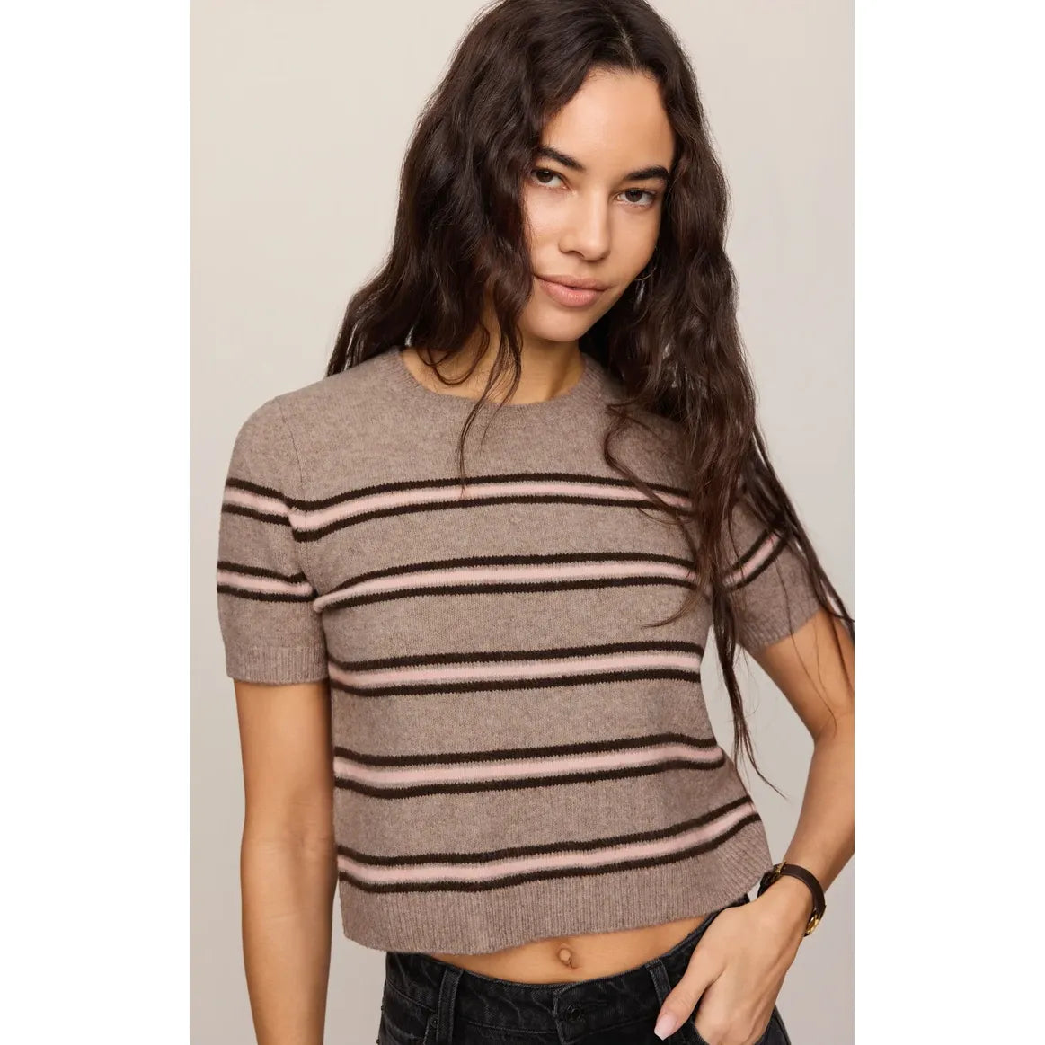 Striped short-sleeve sweater tee in taupe with black and pink horizontal bands, featuring a soft cotton-blend knit and cropped fit.