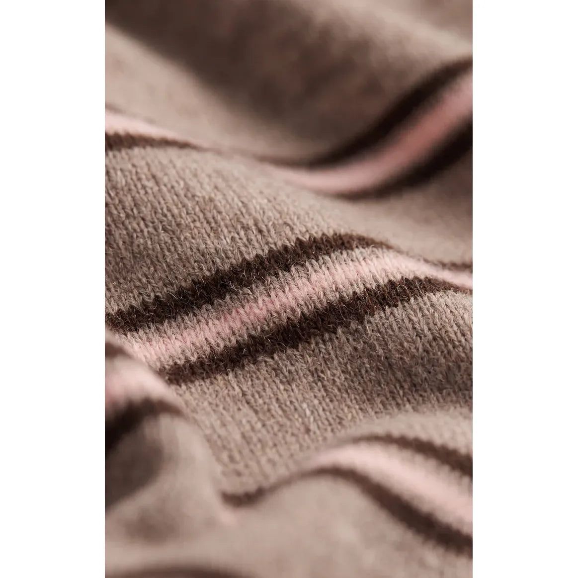 Soft taupe and pink striped sweater knit fabric. Cotton-blend yarn with stretch offers a comfortable, lightweight feel for all-day wear.