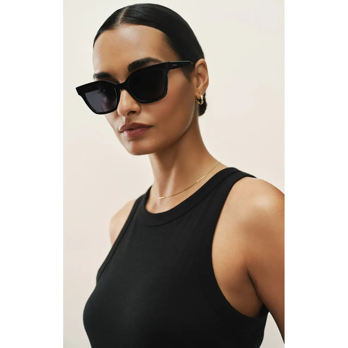 Woman wearing Z Supply High Tide Sunglasses: small-frame, polarized nylon sunglasses with 100% UVA/UVB/UVC protection.