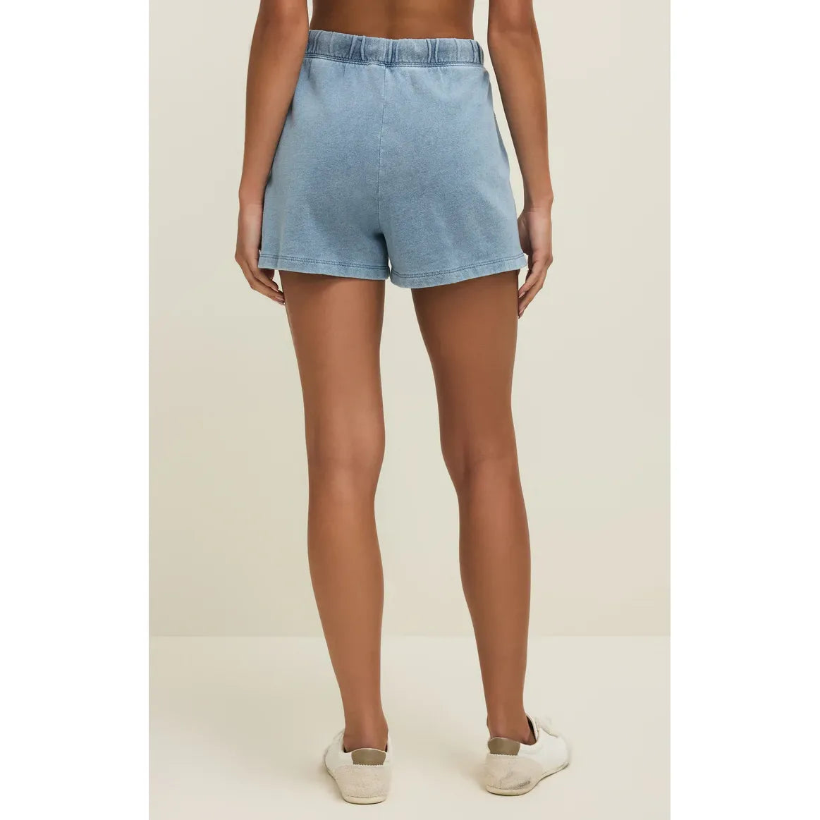 Z Supply Hunter Knit Denim Shorts, light wash, back view on model with high-rise waist and elastic waistband.
