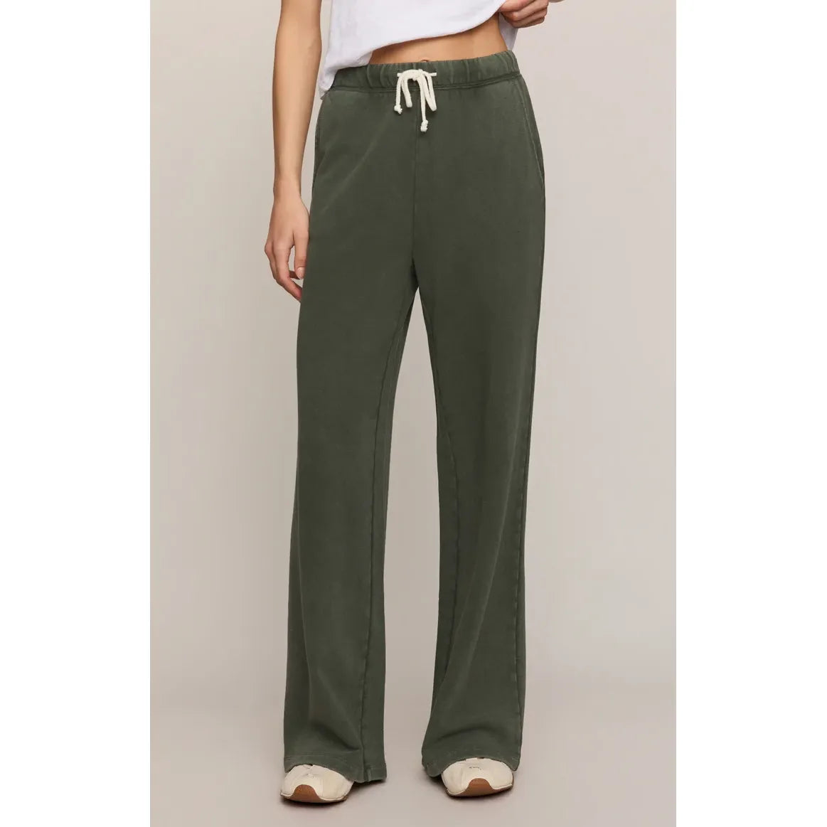 Olive green hunter knit pants with white drawstring and slash pockets. Midweight cotton French terry for relaxed daily comfort.