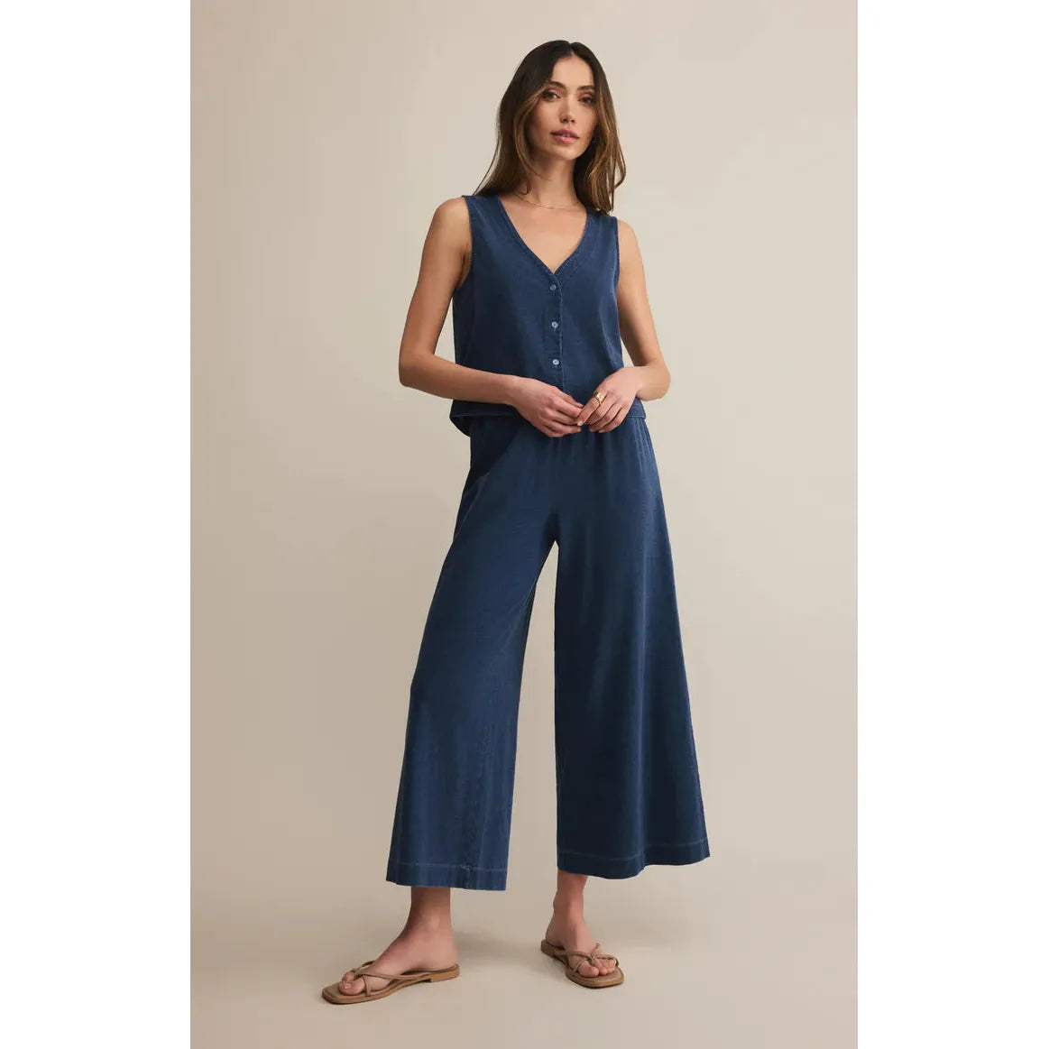 Model wearing Z Supply Scout Jersey Denim Pant in indigo, relaxed wide-leg style paired with tank