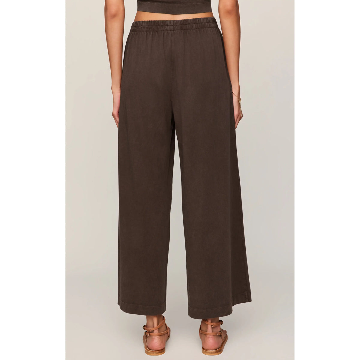 Back view of Z Supply Scout Jersey Crop Flare Pant in brown, high-rise, ankle-length, relaxed-fit.