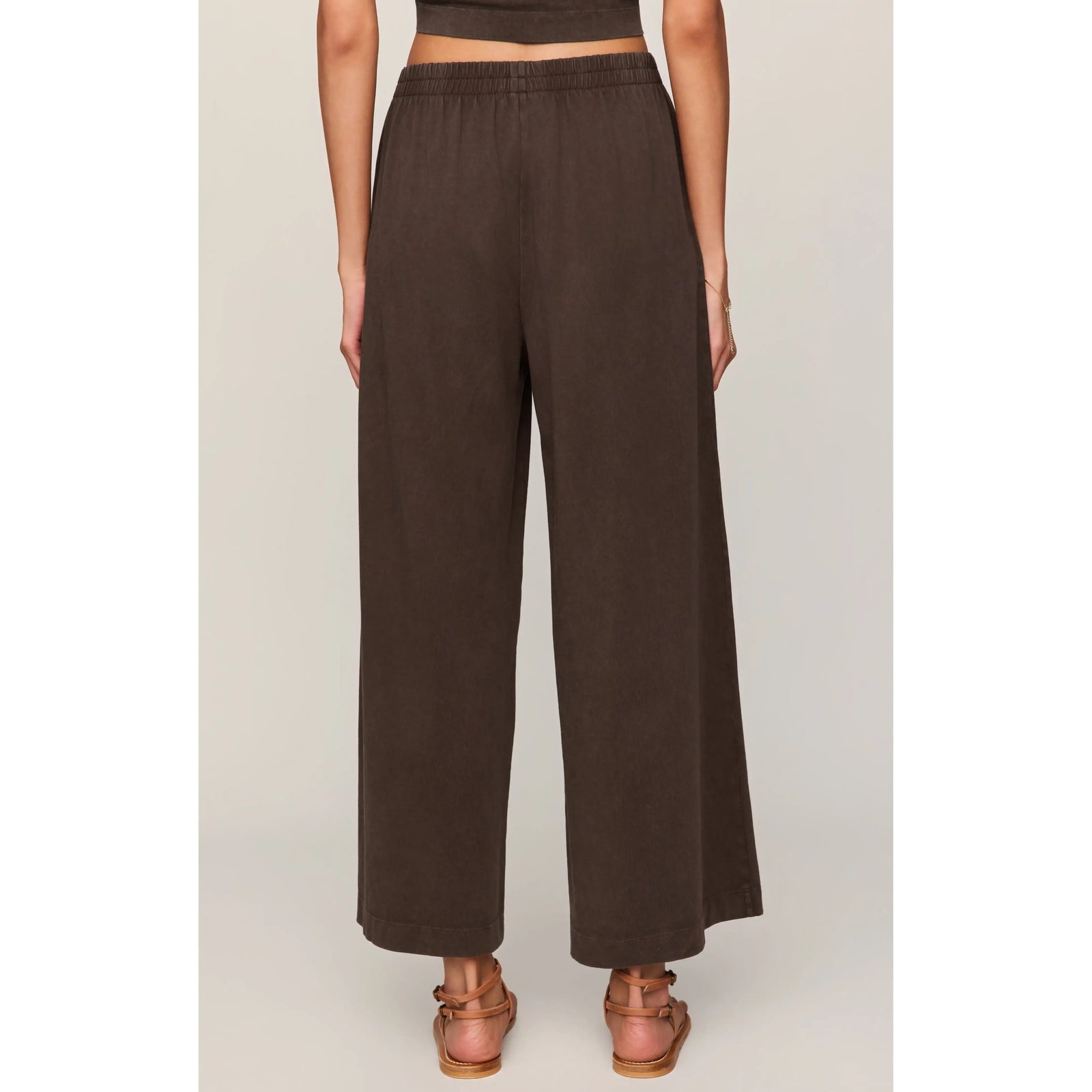 Back view of Z Supply Scout Jersey Crop Flare Pant in brown, high-rise, ankle-length, relaxed-fit.