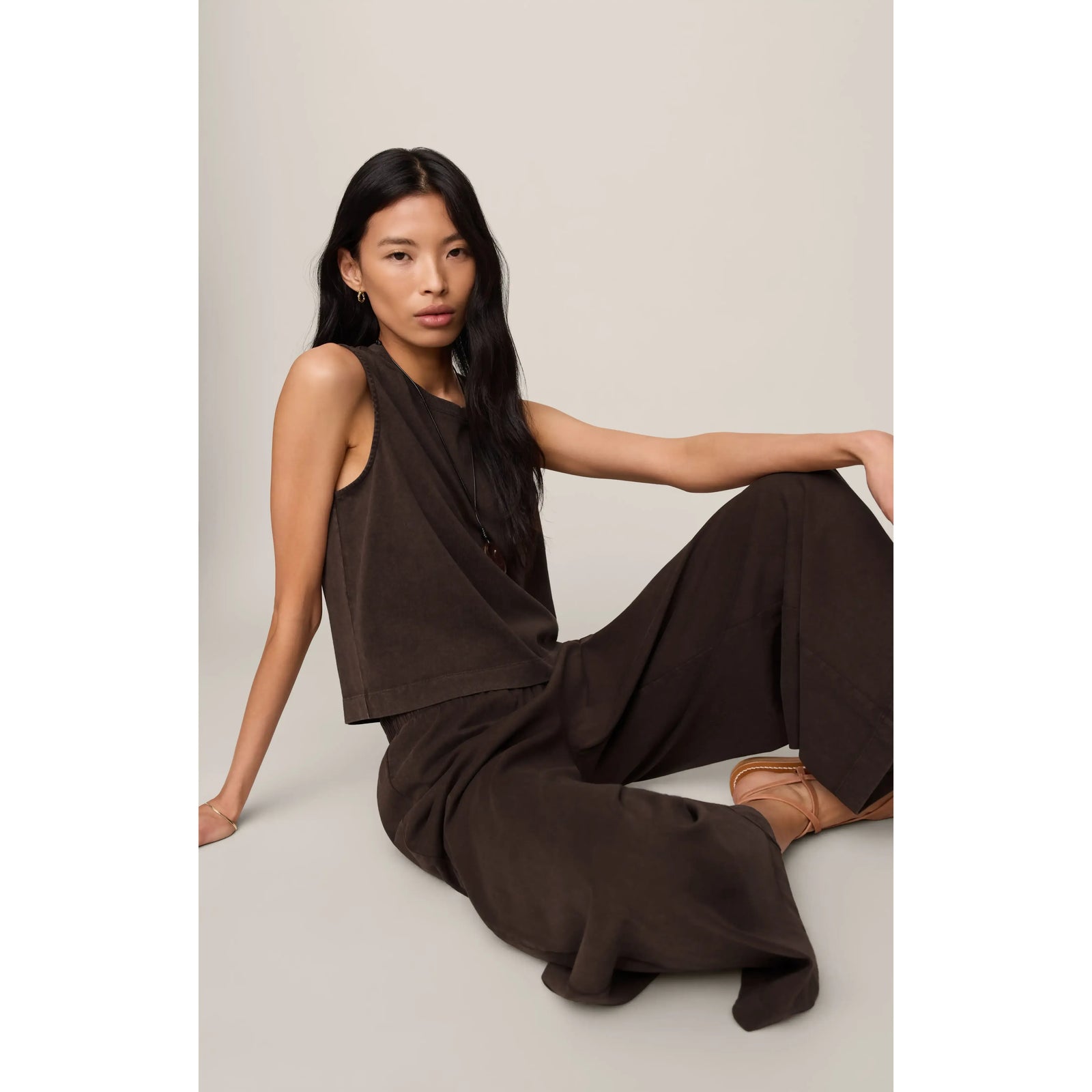 Model in brown Scout Jersey Crop Flare Pant with sleeveless top; relaxed fit, high-rise, cropped flare.