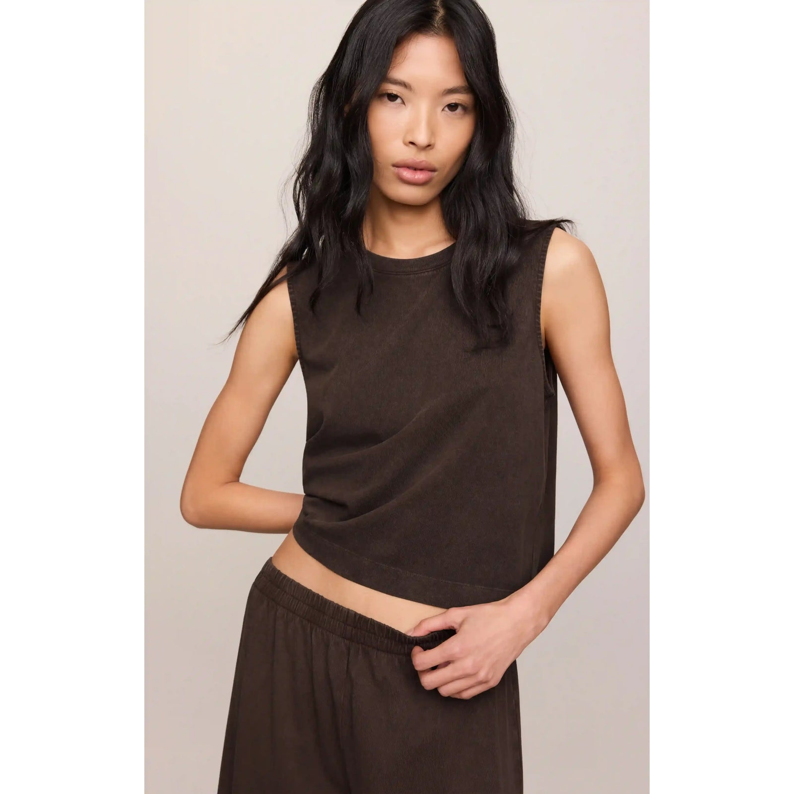 Model in brown sleeveless top styled with Z Supply Scout Jersey Crop Flare Pant - high-rise, relaxed cotton jersey.