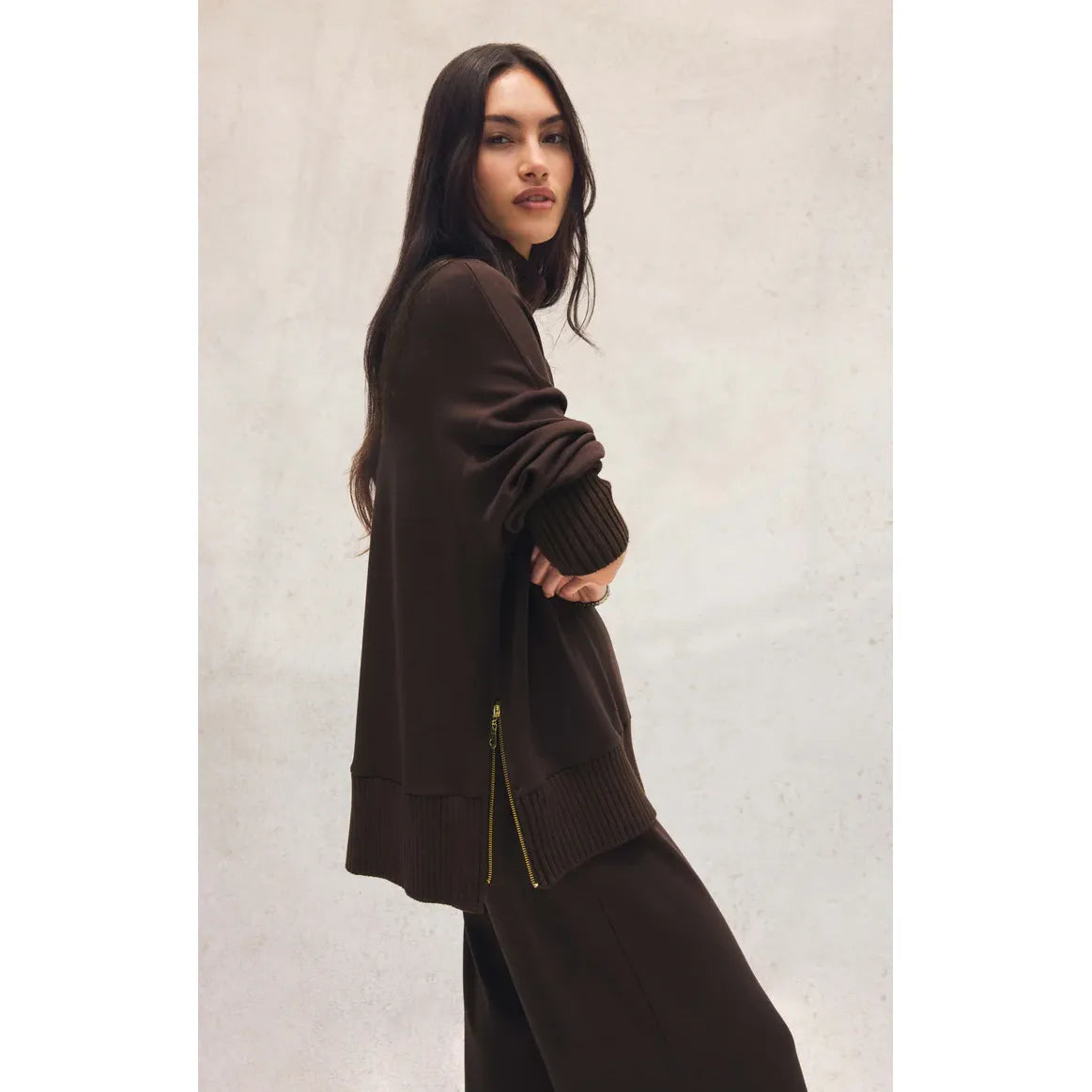 Model in Z Supply Sable Luxe Mock Neck Top in chocolate brown; relaxed midweight knit with ribbed edges and side zips.