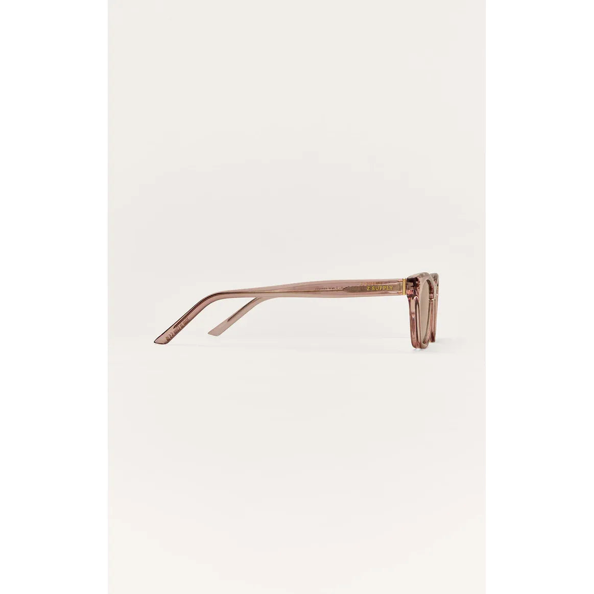 Z Supply MidNite pink translucent cat-eye sunglasses with metal stud details, polarized lenses, nylon frame.
