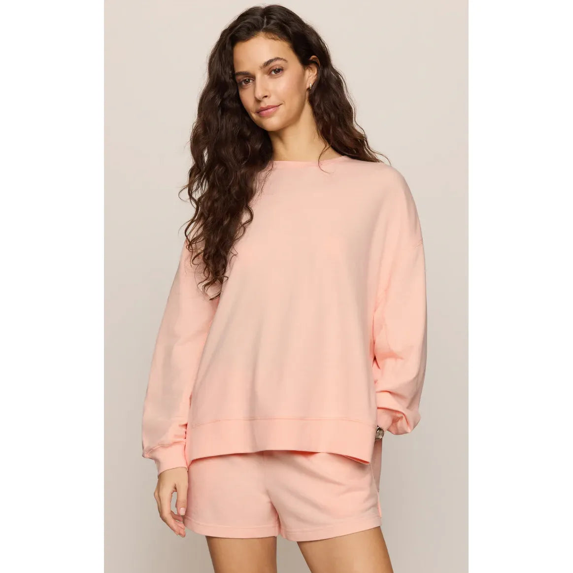 Z Supply Modern Weekender Sweatshirt in soft pink with a relaxed fit, shown with matching shorts.