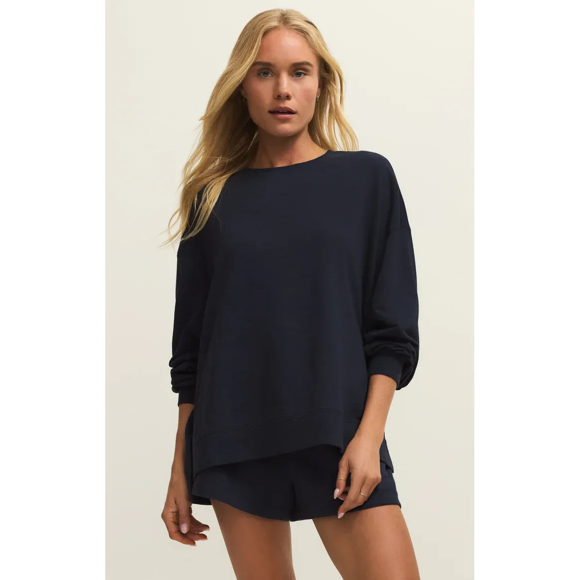 Z Supply Modern Weekender Sweatshirt in navy with relaxed crewneck on model, paired with matching shorts.
