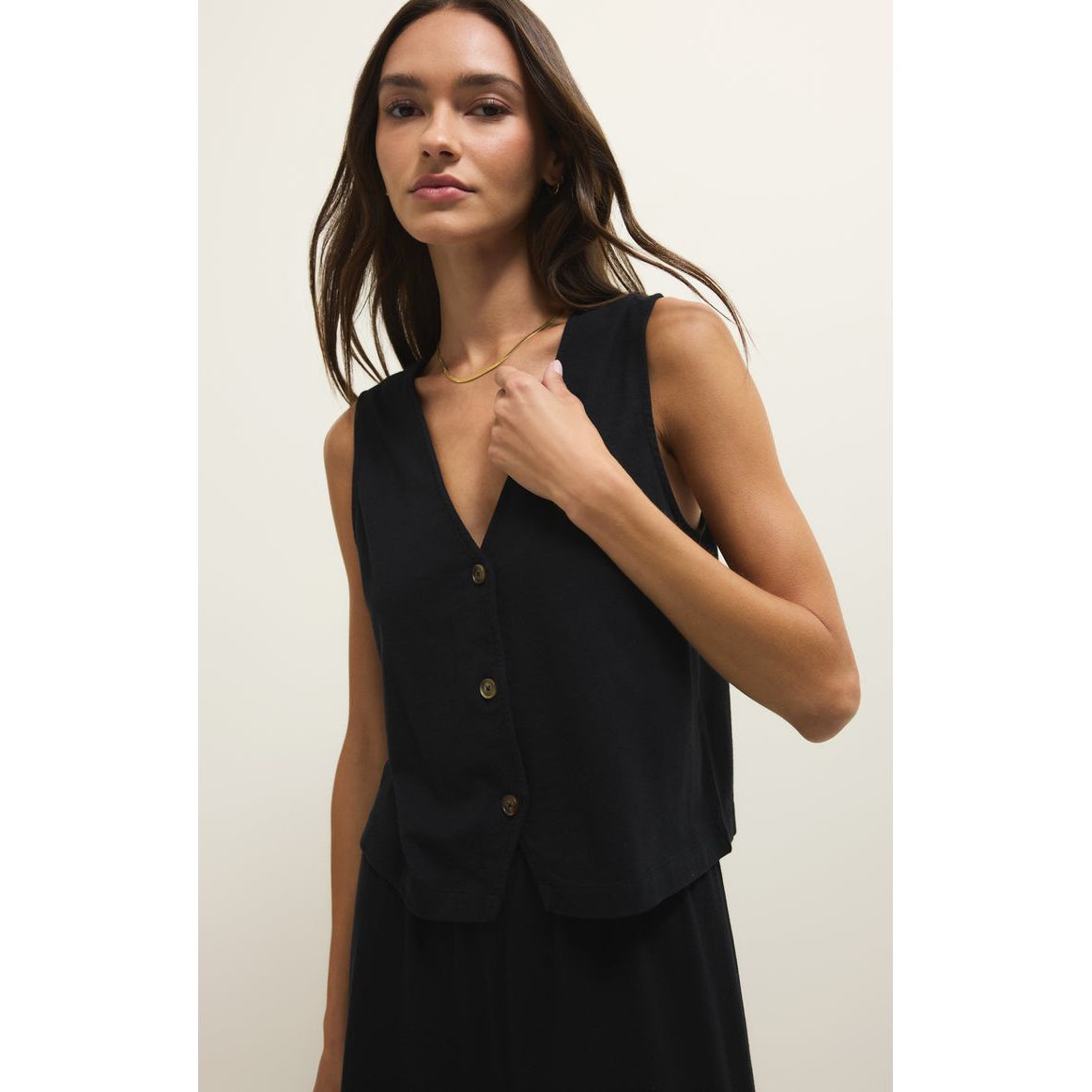 Z Supply Noelle Jersey Sleeveless Top in black with V-neck and button-front, worn by model.