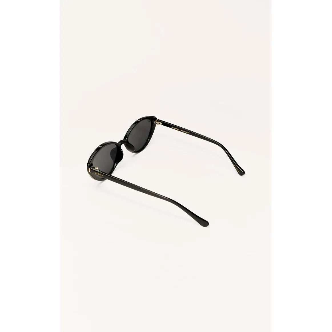 Z Supply Nouveau sunglasses with cat-eye silhouette, black injected nylon frame, polarized lenses, gold accents.