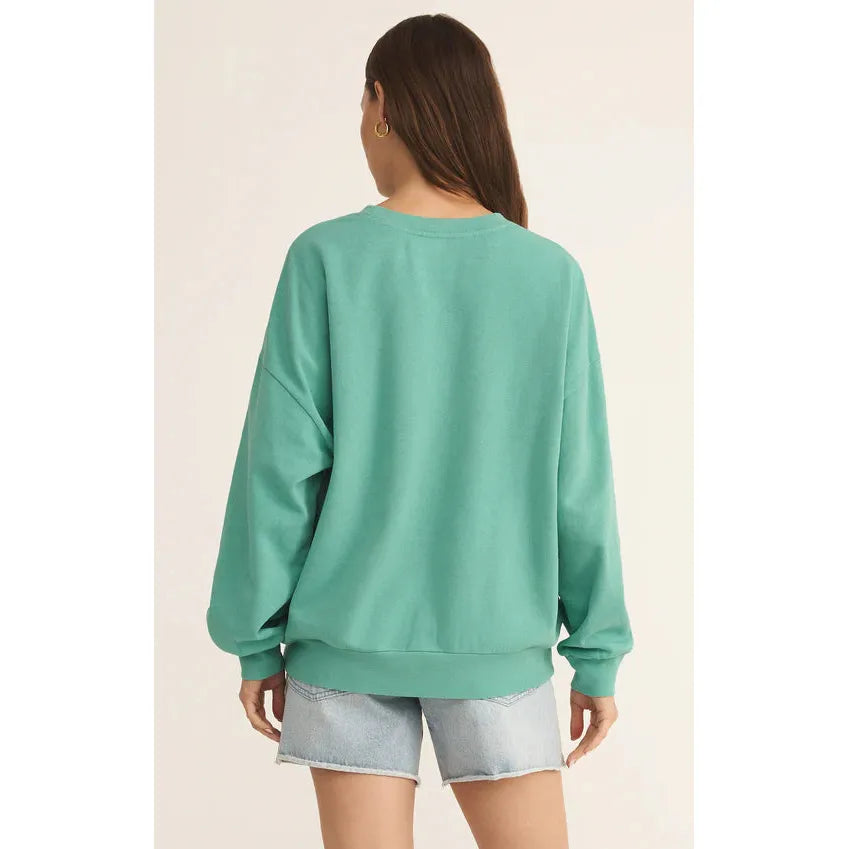 Relax in the Z Supply Palms Sunday Sweatshirt, featuring a cozy aqua hue and oversized fit for ultimate comfort.