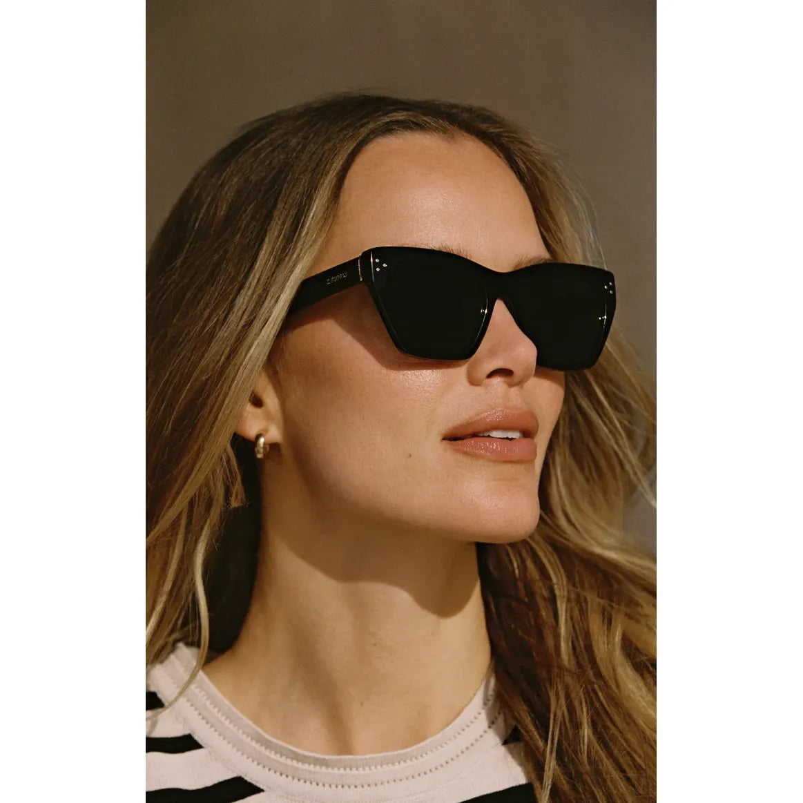 Z Supply Park Avenue Sunglasses on a model; medium-sized, chic rectangular frame with polarized lenses.