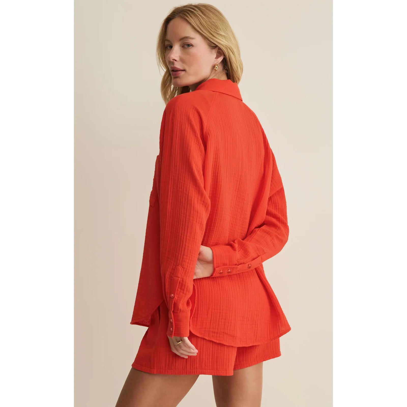 Model wearing coral Z Supply Perfect Airy Gauze Button Up Top with relaxed fit, delicate buttons, and crinkle texture.
