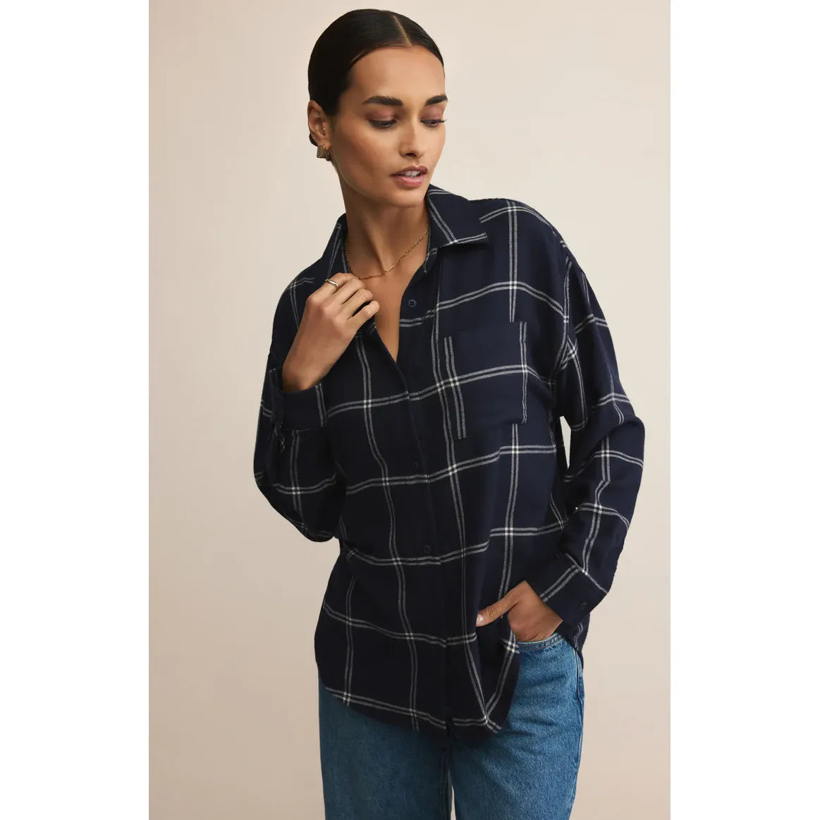 Sharlene wears Z Supply River plaid button-up top in size small, navy with white lines and a relaxed fit.