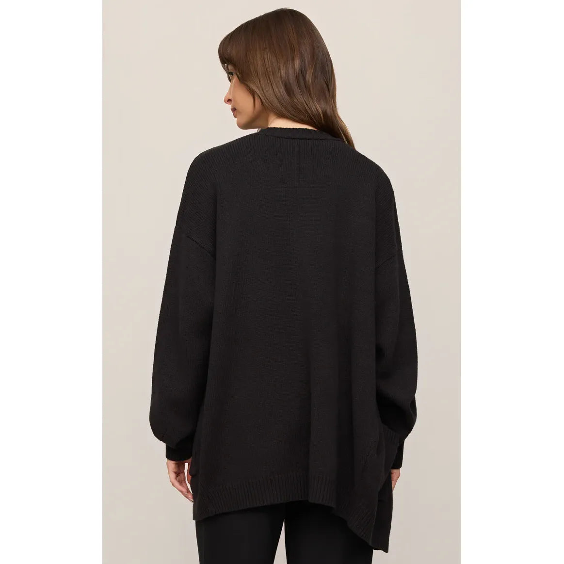 Back view of black Z Supply Sanborn Cardigan on a model; oversized cotton-blend knit with ribbed cuffs and hem.