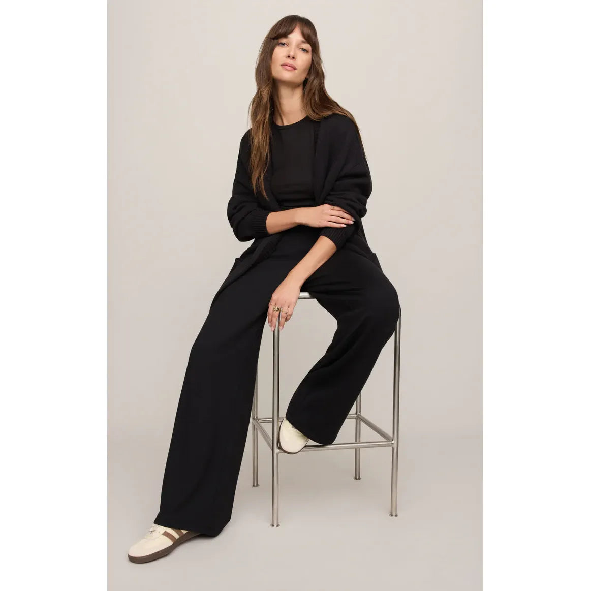 Model wearing Z Supply Sanborn Cardigan in black with relaxed fit, ribbed trim, and oversized pockets.