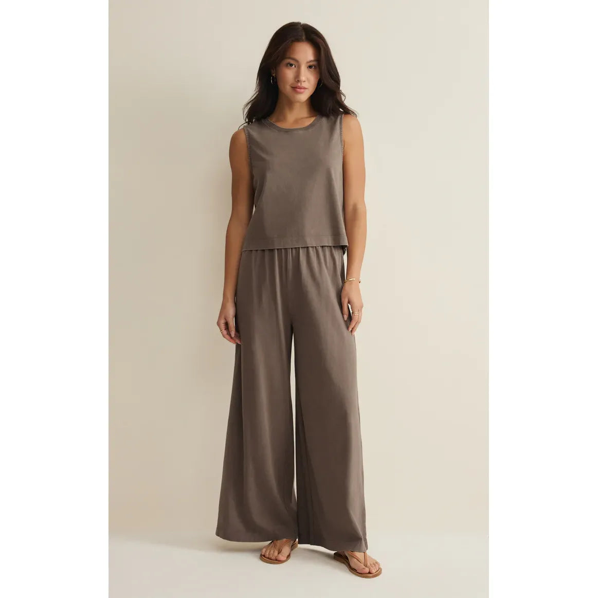 Model wearing taupe Z Supply Scout Jersey Flare Pant set; high-rise, relaxed wide-leg crop flare pants.