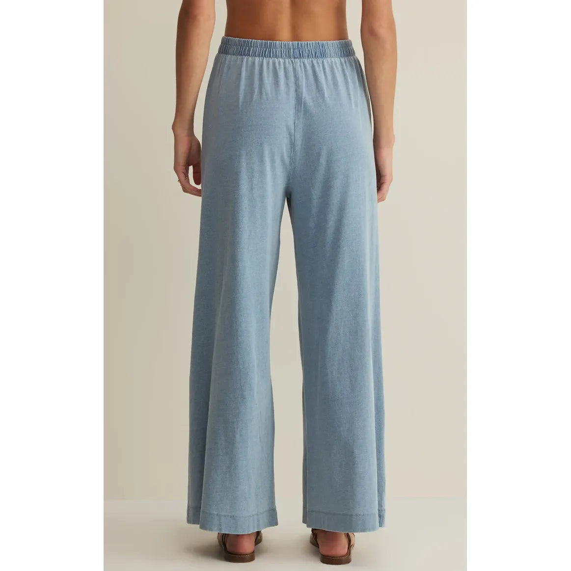 Back view of Z Supply Scout Jersey Crop Flare Pant in light blue cotton jersey, high-rise, ankle-length, elastic waist.