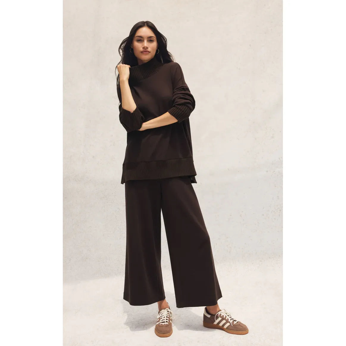 Model wearing Z Supply Scout Luxe Pant in dark brown ribbed knit, high-rise, ankle-length with a relaxed wide-leg.