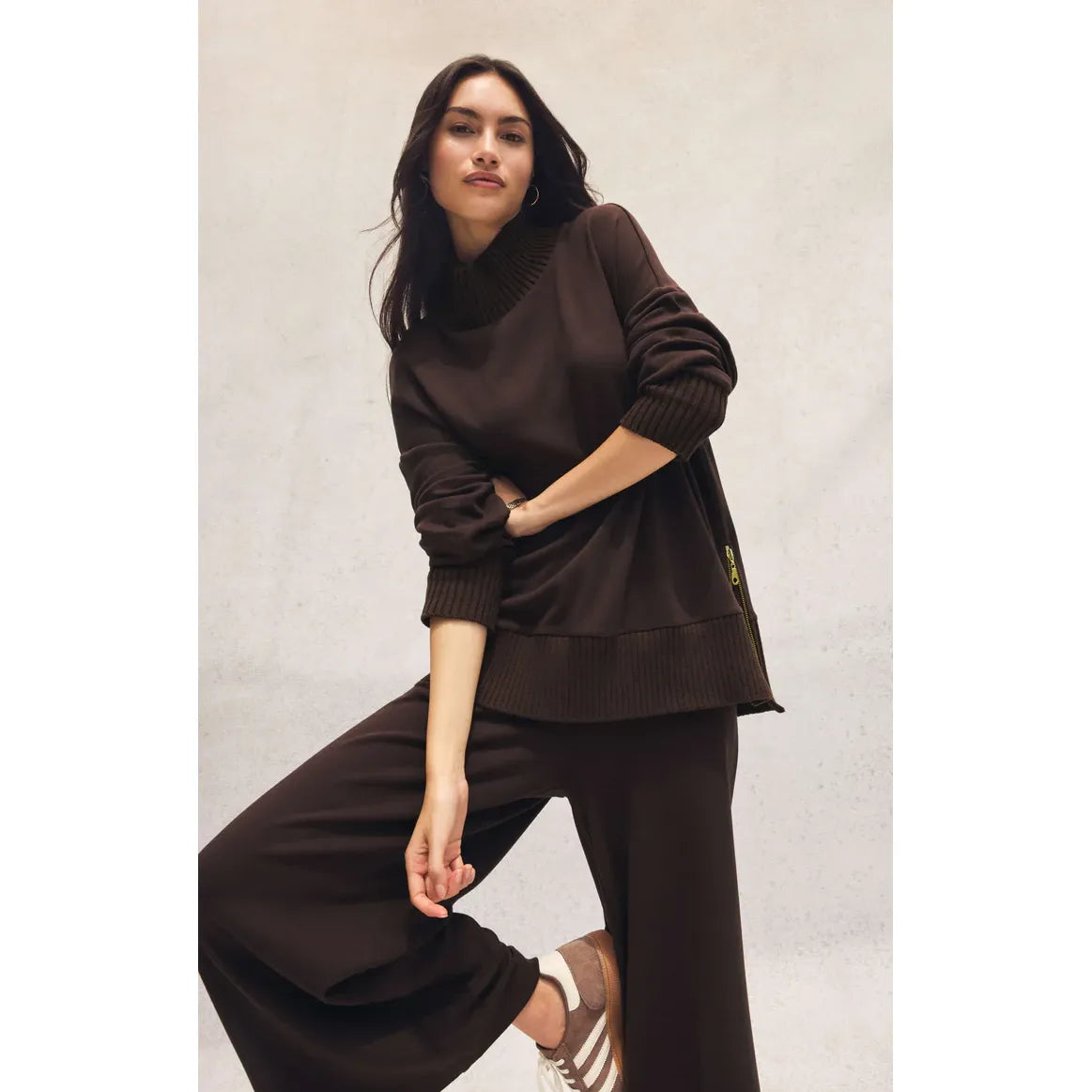Model wearing chocolate brown Z Supply Scout Luxe Pant with high-rise, ribbed knit, wide-leg silhouette.