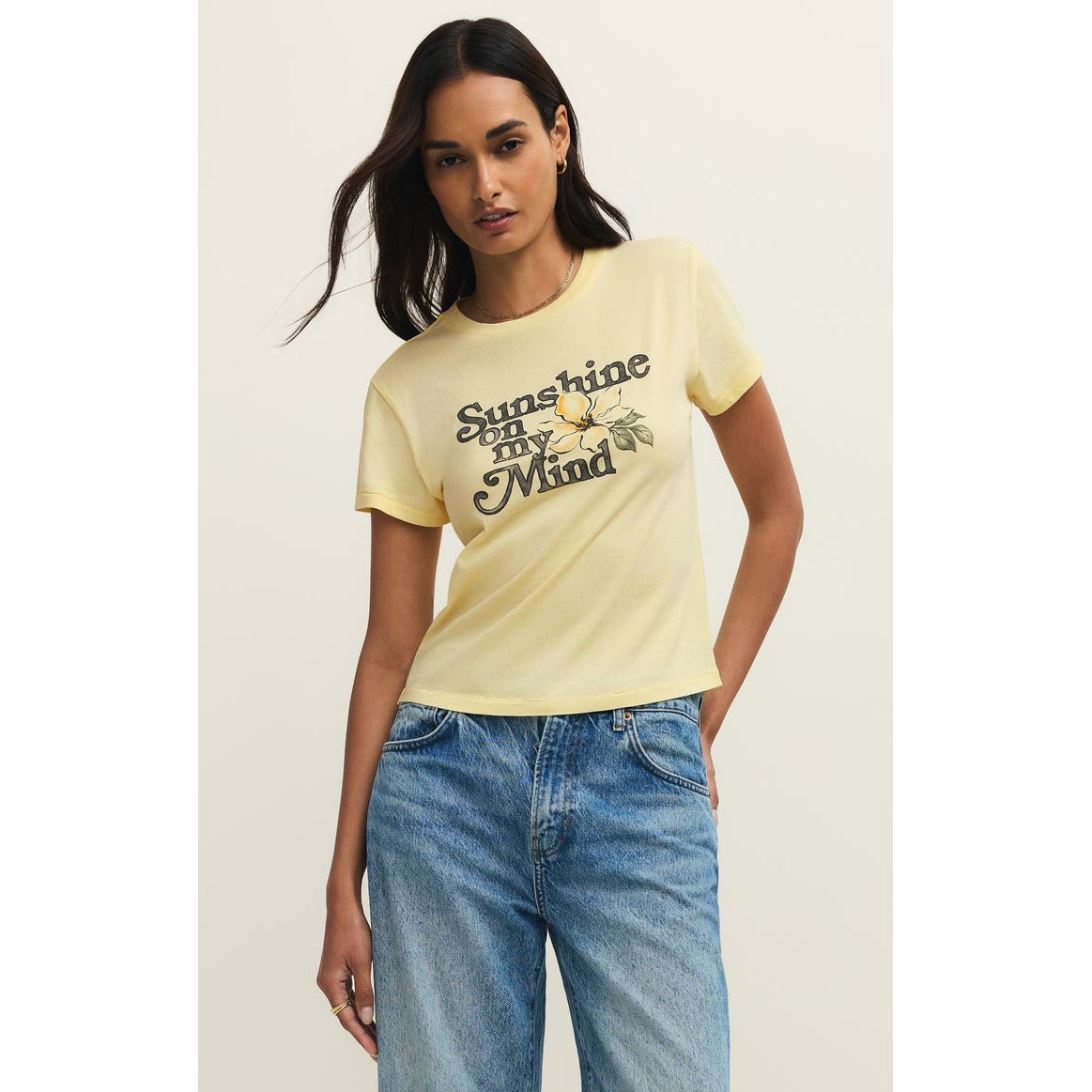 Pale yellow Z Supply Shine Tourist Tee with lemon graphic and Sunshine on my Mind, paired with blue denim jeans.