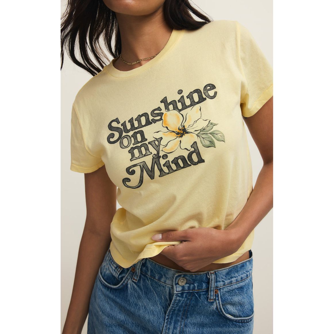 Z Supply Shine Tourist Tee in pale yellow featuring Sunshine on my Mind graphic with a floral illustration.