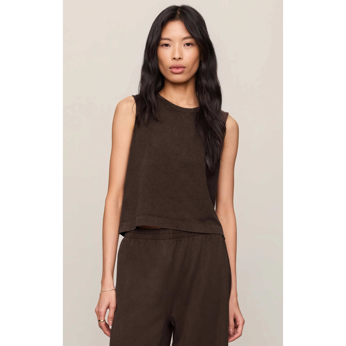 Model wearing Z Supply Sloane Muscle Jersey Tank in brown, sleeveless crew-neck with relaxed fit.
