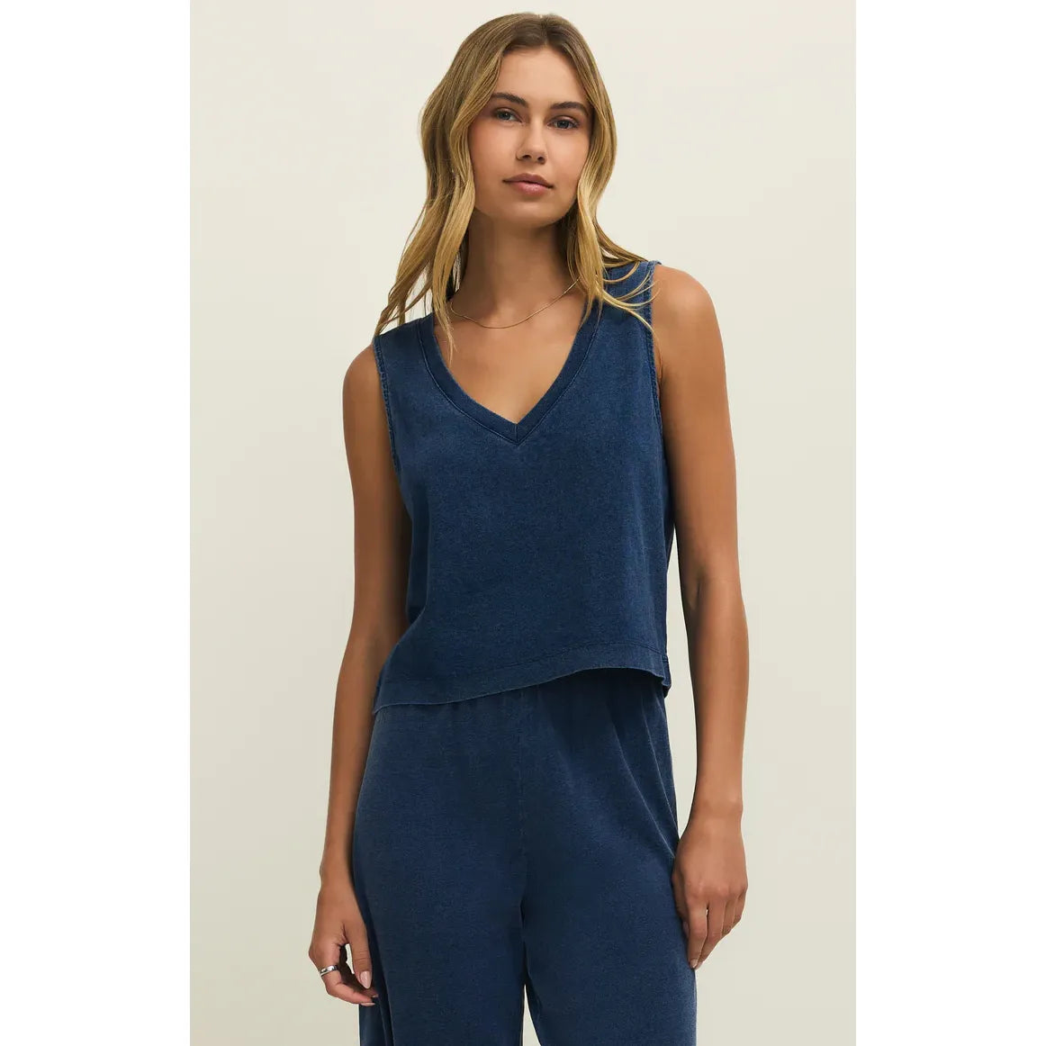Z Supply Sloane V-Neck Denim Tank top in blue, relaxed-fit sleeveless cotton jersey on model