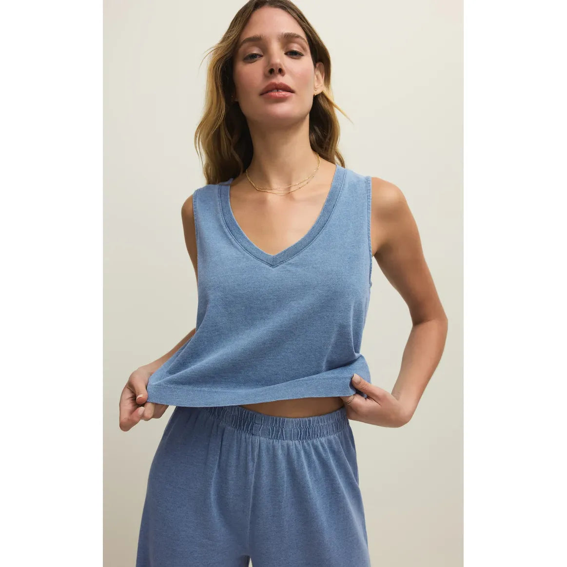 Z Supply Sloane V-Neck Denim Tank in light blue on model with matching relaxed shorts.