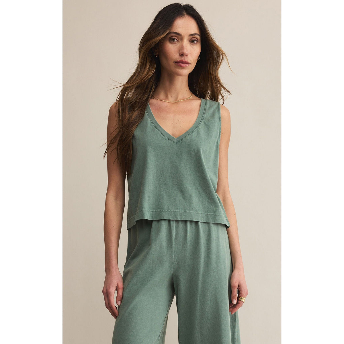 Model in sage green Z Supply Sloane V-Neck Tank, sleeveless with a relaxed fit.