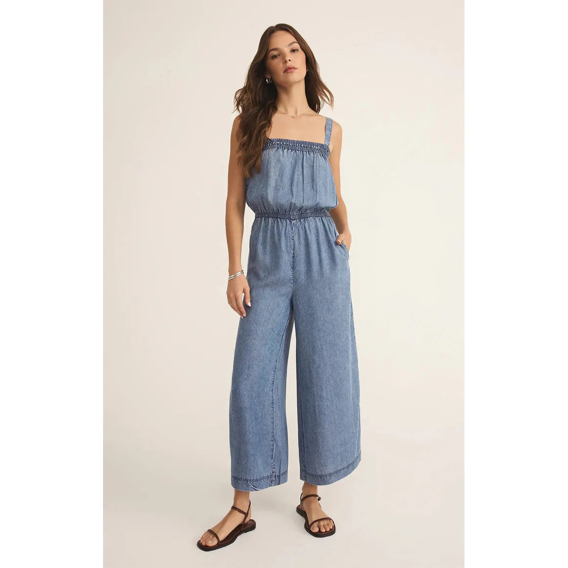Stylish Z Supply Solara Chambray Jumpsuit features a square neckline and adjustable straps for a chic look.