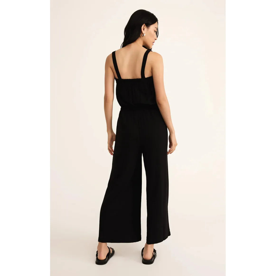 Effortlessly stylish, the Z Supply Solara Linen Jumpsuit features a wide-leg design and adjustable straps for comfort.