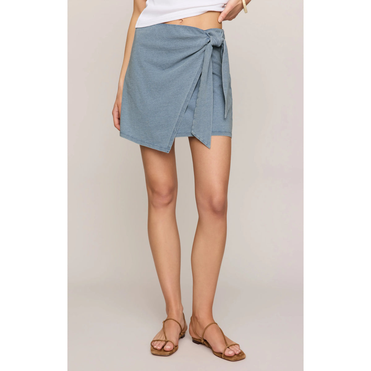 Z Supply Sora Denim Mini Skirt with pull-on wrap front and adjustable side tie.