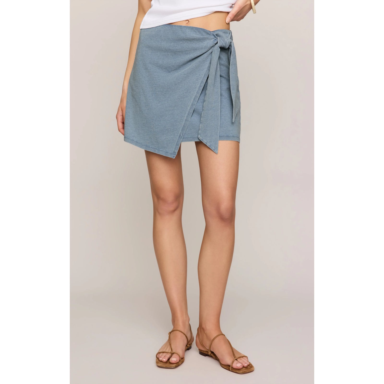 Z Supply Sora Denim Mini Skirt with pull-on wrap front and adjustable side tie.