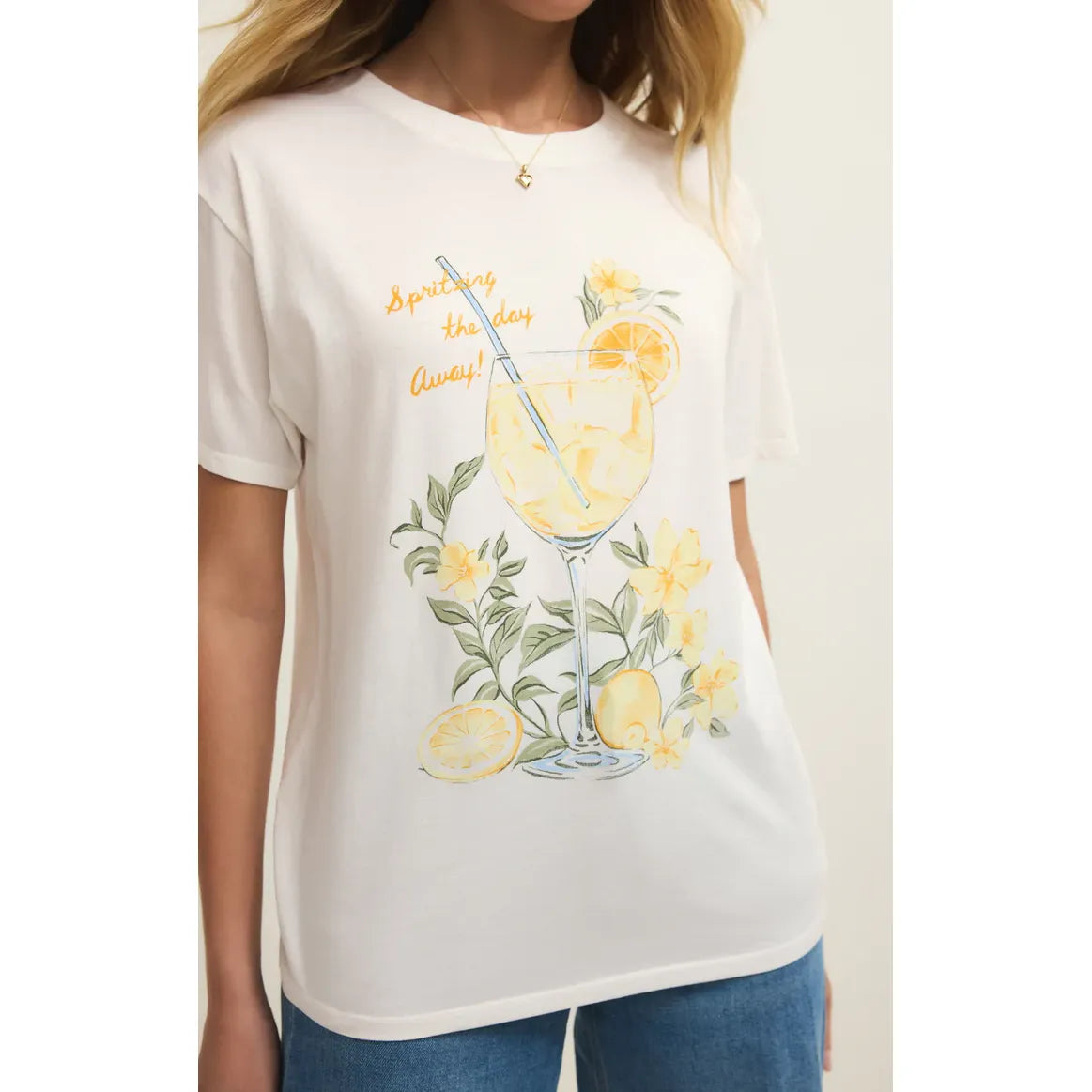 Z Supply Spritz Boyfriend Tee with citrus spritz graphic: glass, lemon and orange slices, yellow flowers.