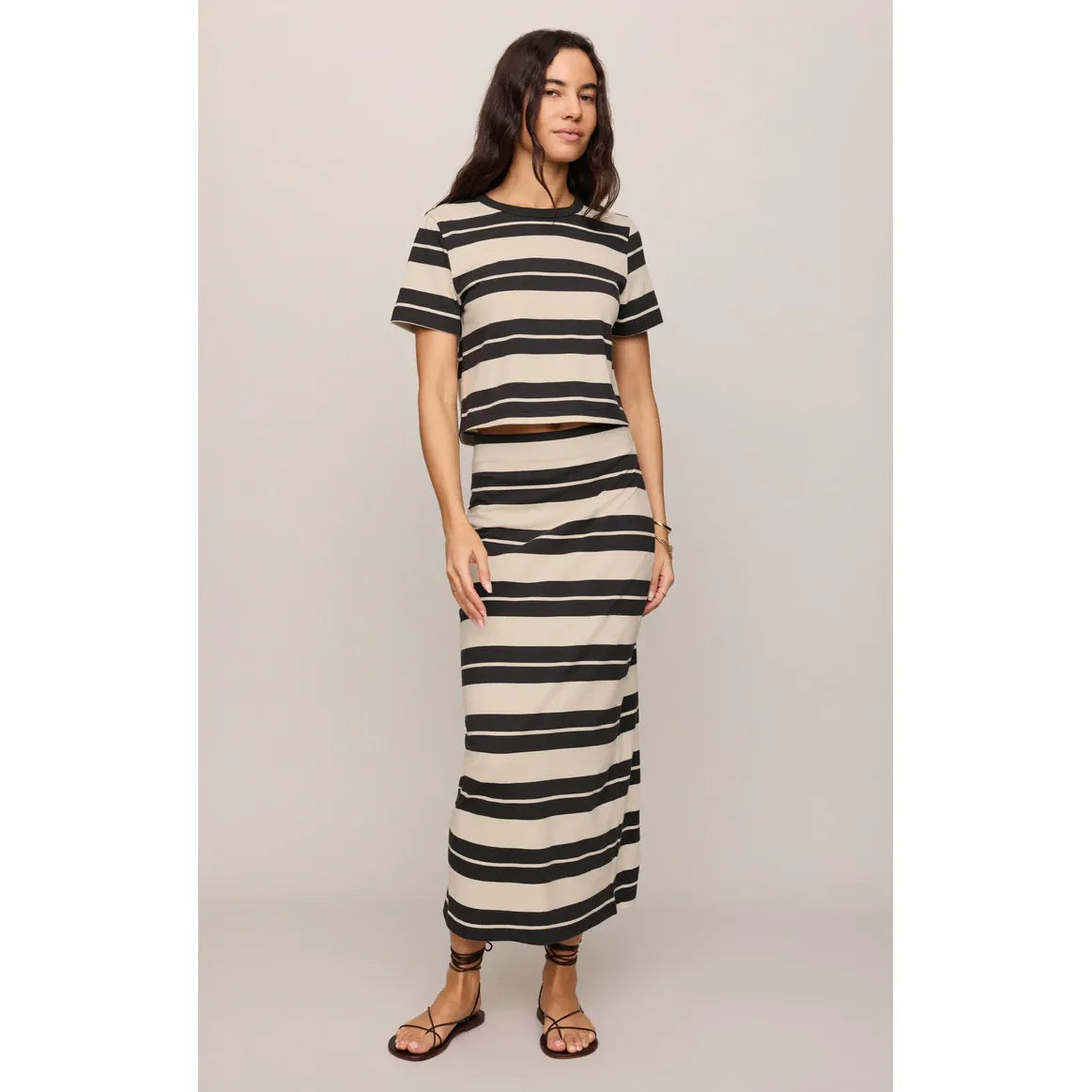 Model wearing Z Supply Stellan Striped Tee with matching beige-black striped maxi skirt.