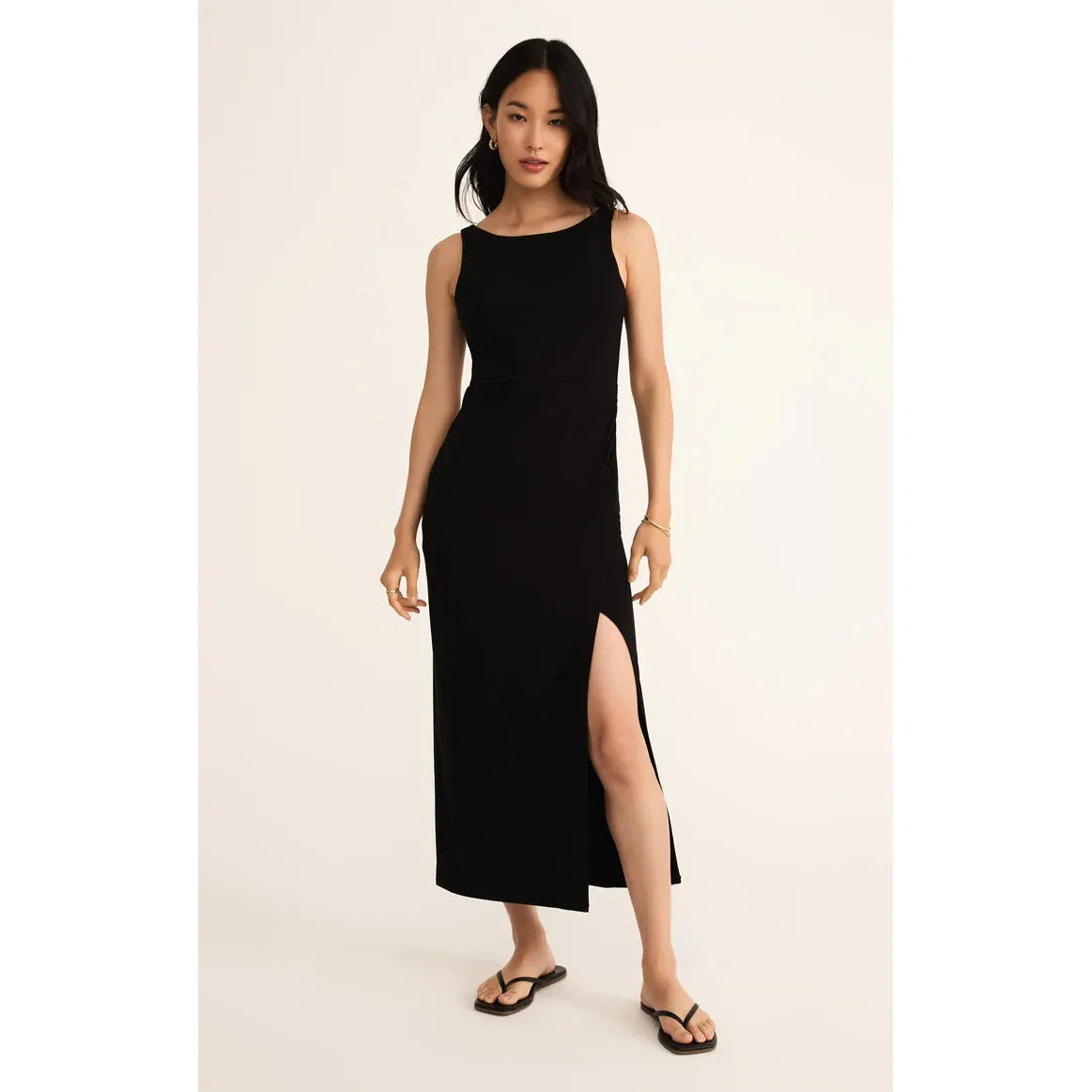 Stylish Z Supply Valencia Midi Dress in black, featuring a fitted silhouette and playful mid-thigh slit for a flattering look.