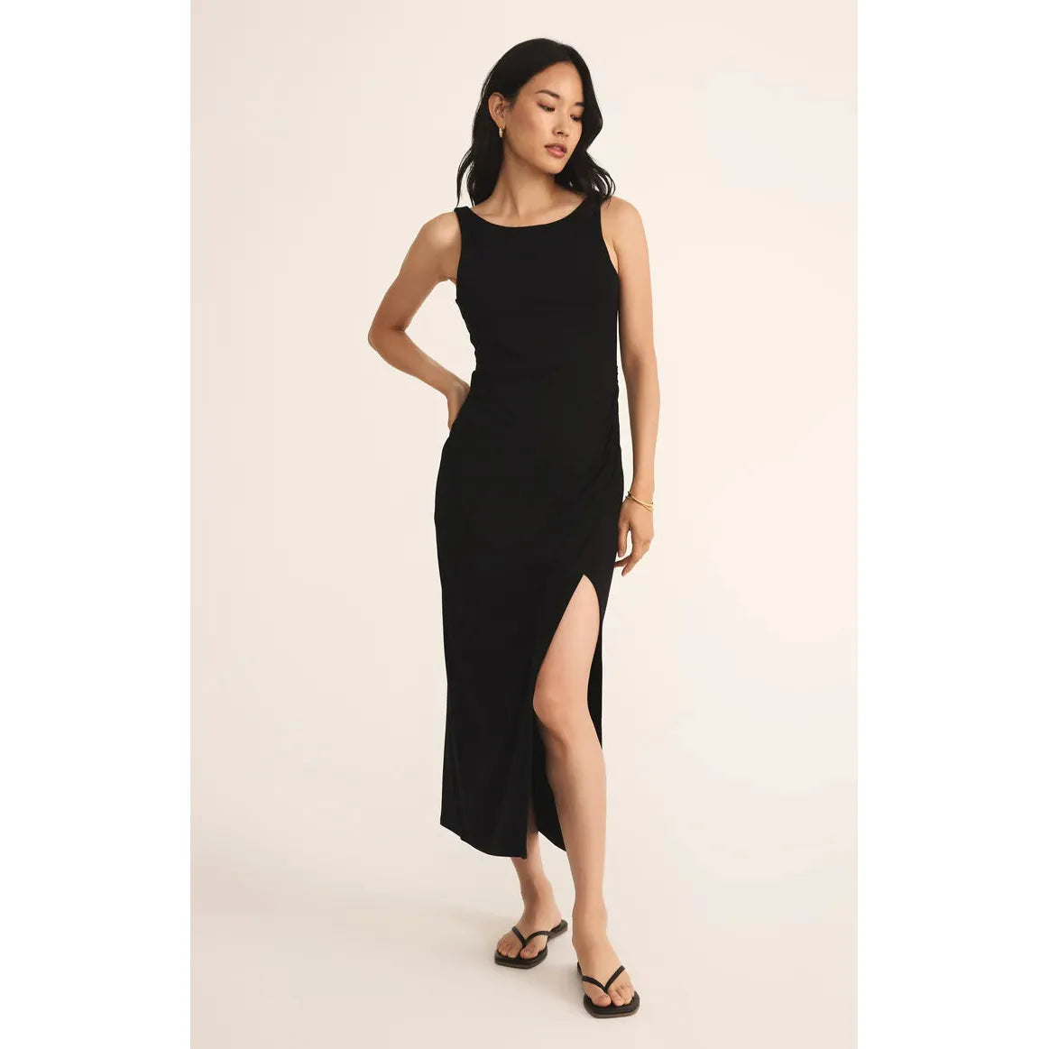 The Z Supply Valencia Midi Dress features a flattering fit, wide straps, and a stylish mid-thigh slit for a chic look.