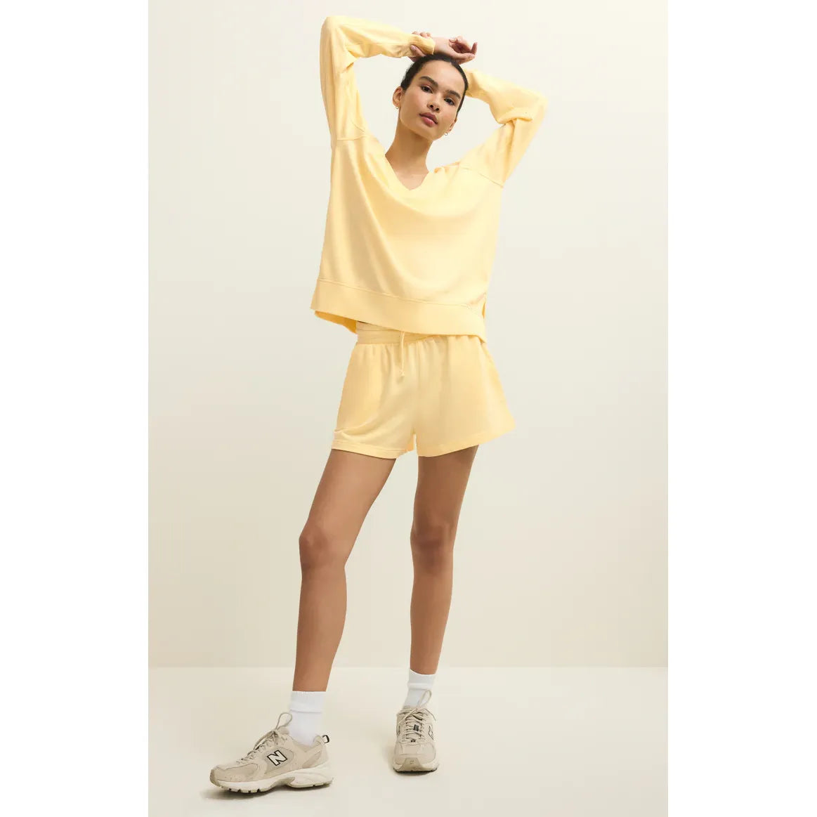 Z Supply Weekender V-Neck pastel yellow lounge set with a relaxed V-neck sweatshirt and matching shorts.