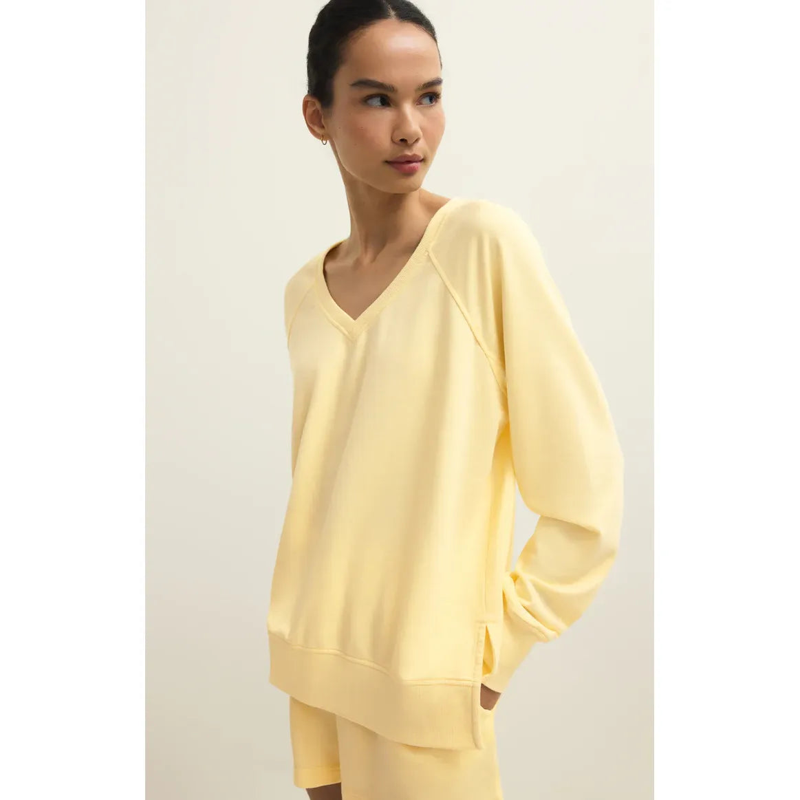 Z Supply Weekender V-Neck pale yellow relaxed-fit sweatshirt with V-neck on model