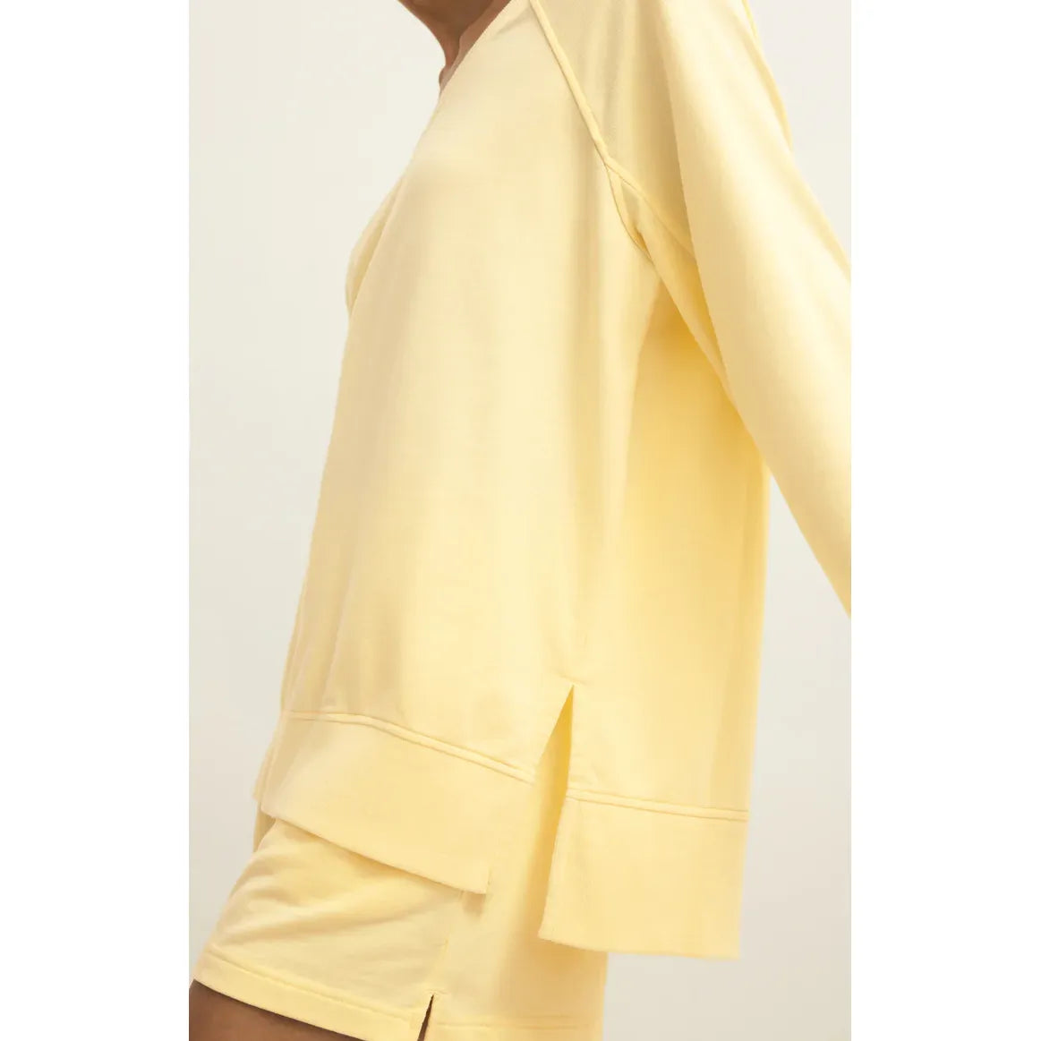 Z Supply Weekender V-Neck in pale yellow, buttery-soft relaxed-fit sweatshirt with side slits.